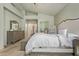 Main bedroom featuring neutral tones, ensuite bathroom entrance, a ceiling fan, and carpet flooring at 4584 W Detroit St, Chandler, AZ 85226