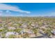 Scenic aerial of desert home with pool, solar panels, mature landscaping, framed against mountain views at 4706 E Rancho Caliente Dr, Cave Creek, AZ 85331