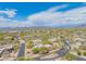 Expansive aerial view showcases desert home with lush landscaping and terracotta tile roof in a desirable community at 4706 E Rancho Caliente Dr, Cave Creek, AZ 85331