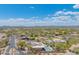 Beautiful aerial view of a home with a pool, desert landscape and mountain views at 4706 E Rancho Caliente Dr, Cave Creek, AZ 85331