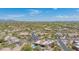 Panoramic aerial of a desert community with unique homes, each enhanced by mature landscaping and desert flora at 4706 E Rancho Caliente Dr, Cave Creek, AZ 85331