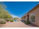 A backyard oasis with a pool, covered patio, and desert landscaping enhances the property's appeal at 4706 E Rancho Caliente Dr, Cave Creek, AZ 85331