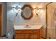 Bathroom with framed mirror, stylish sconces, and a modern glass-enclosed shower at 4706 E Rancho Caliente Dr, Cave Creek, AZ 85331