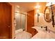 Bathroom features a glass door shower and marble-style vanity sink at 4706 E Rancho Caliente Dr, Cave Creek, AZ 85331