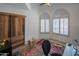 Bright bedroom with a barn door, large windows, and colorful decor at 4706 E Rancho Caliente Dr, Cave Creek, AZ 85331