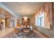 Elegant dining room boasts chandelier, large window, and hardwood chairs with dining table at 4706 E Rancho Caliente Dr, Cave Creek, AZ 85331