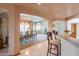 Elegant dining room with tiled floors, arched entryways and adjacent breakfast bar at 4706 E Rancho Caliente Dr, Cave Creek, AZ 85331