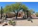 Spacious single-story home featuring desert landscaping and a beautiful terracotta tile roof at 4706 E Rancho Caliente Dr, Cave Creek, AZ 85331