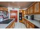 Kitchen with light countertops, wooden cabinets and island cooktop at 4706 E Rancho Caliente Dr, Cave Creek, AZ 85331