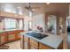 Kitchen island featuring an electric cooktop; arched entry to dining room at 4706 E Rancho Caliente Dr, Cave Creek, AZ 85331