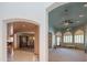View from entry to formal dining room and living room with bay windows and ceiling fans at 4706 E Rancho Caliente Dr, Cave Creek, AZ 85331