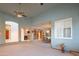 Expansive living room with carpet, ceiling fan, access to kitchen and dining areas, perfect for entertaining at 4706 E Rancho Caliente Dr, Cave Creek, AZ 85331