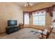 Open living room featuring neutral carpeting, television and sitting area at 4706 E Rancho Caliente Dr, Cave Creek, AZ 85331