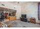 A comfortable living area with an open kitchen, a TV, and soft, neutral tones at 4706 E Rancho Caliente Dr, Cave Creek, AZ 85331