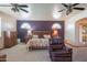 Well-lit main bedroom with a seating area, ceiling fans and traditional style furnishings at 4706 E Rancho Caliente Dr, Cave Creek, AZ 85331