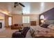 Spacious bedroom with a fireplace, sitting area, and comfortable furnishings at 4706 E Rancho Caliente Dr, Cave Creek, AZ 85331