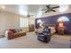 Spacious main bedroom featuring a seating area, ceiling fans, and elegant wooden furniture at 4706 E Rancho Caliente Dr, Cave Creek, AZ 85331