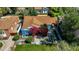 Aerial shot of a home with a manicured lawn, bougainvillea, and a paved patio at 512 W Roma Ave, Phoenix, AZ 85013