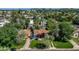 Aerial view of a charming neighborhood showcasing well-maintained homes, lush trees, and scenic surroundings at 512 W Roma Ave, Phoenix, AZ 85013