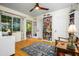 Comfortable bedroom with hardwood floors, natural light, and access to an outdoor patio at 512 W Roma Ave, Phoenix, AZ 85013