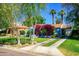 Attractive home featuring lush landscaping, mature trees, and a well-maintained lawn at 512 W Roma Ave, Phoenix, AZ 85013