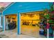 Spacious two-car garage with ample storage, overhead lighting and tools and equipment organized at 512 W Roma Ave, Phoenix, AZ 85013