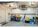 Well-organized garage featuring storage cabinets, a work sink, and organized tools at 512 W Roma Ave, Phoenix, AZ 85013