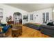 Bright living room showcasing hardwood floors, ample natural light, and classic archway details at 512 W Roma Ave, Phoenix, AZ 85013