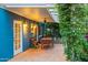 Charming covered patio with climbing vines, dining furniture, and a peaceful outdoor ambiance at 512 W Roma Ave, Phoenix, AZ 85013