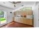 Bright bonus room with built-in cabinets, a door to outside, and clerestory windows at 512 W Roma Ave, Phoenix, AZ 85013