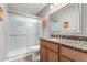 Bathroom featuring a glass shower door and granite countertops at 523 W 14Th St, Tempe, AZ 85281