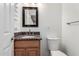 Updated bathroom features granite countertops and a mirror at 523 W 14Th St, Tempe, AZ 85281
