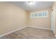 Bright bedroom featuring wood-look floors and a window with white shutter blinds at 523 W 14Th St, Tempe, AZ 85281