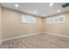 Bright bedroom featuring wood-look floors and sunlit windows with blinds at 523 W 14Th St, Tempe, AZ 85281