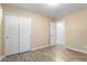Bedroom features wood-look floors and a closet and adjacent access to another room at 523 W 14Th St, Tempe, AZ 85281