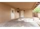 Carport featuring a brick wall, white doors and window at 523 W 14Th St, Tempe, AZ 85281