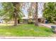 Charming single-story home with a well-maintained lawn and mature trees enhancing its curb appeal at 523 W 14Th St, Tempe, AZ 85281