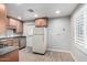 Functional kitchen features stainless steel appliances, neutral cabinets, and modern countertops at 523 W 14Th St, Tempe, AZ 85281