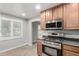 Modern kitchen features stainless steel appliances, wood cabinets, and an open layout at 523 W 14Th St, Tempe, AZ 85281