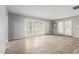 Bright living room showcasing wood-look floors, plantation shutters, and neutral paint scheme at 523 W 14Th St, Tempe, AZ 85281