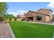 The large artificial lawn is a standout feature in this backyard at 5330 W Morgan Pl, Chandler, AZ 85226