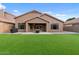 This home offers a backyard with artificial grass and a fire pit at 5330 W Morgan Pl, Chandler, AZ 85226