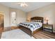 A cozy bedroom featuring hardwood floors, a ceiling fan, and a comfortable bed with neutral decor at 5330 W Morgan Pl, Chandler, AZ 85226