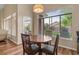 Cozy breakfast nook with wood table and chairs near the backyard at 5330 W Morgan Pl, Chandler, AZ 85226