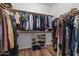 Well-organized walk-in closet with ample storage space for clothing and shoes at 5330 W Morgan Pl, Chandler, AZ 85226