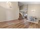 Spacious dining area highlighting laminate floors and an elegant staircase at 5330 W Morgan Pl, Chandler, AZ 85226