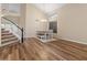 Dining room area showcasing laminate flooring, a staircase, and modern lighting at 5330 W Morgan Pl, Chandler, AZ 85226