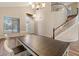 Home entryway highlighting laminate flooring, a staircase, and a dining area at 5330 W Morgan Pl, Chandler, AZ 85226