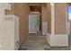 Inviting home entrance with a modern door, desert landscaping and stacked stone columns at 5330 W Morgan Pl, Chandler, AZ 85226