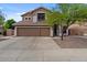 Two-story home featuring a three-car garage and desert landscaping at 5330 W Morgan Pl, Chandler, AZ 85226